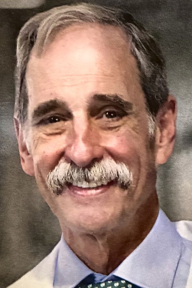 Dr. Felix H. &ldquo;Buddy&rdquo; Savoie, III, in his white coat (photo: Inside New Orleans)